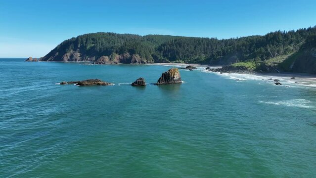 Surrounded by ocean, rugged sea stacks lie just off the Northern Oregon shoreline, not far west of Portland. This part of the Pacific Northwest is full of scenic forests and impressive coastlines.