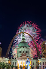 4th of July Independence Day Celebration Fireworks over Famous Gateway Arch of Saint Louis, with Court House Building  in the foreground, St Louis, Missouri, USA