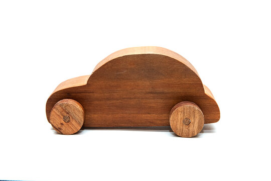wooden toy car made from cherry wood, isolated on a white background