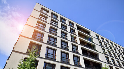 Modern luxury residential flat. Modern apartment building on a sunny day. Apartment building with a blue sky. Facade of a modern apartment building.