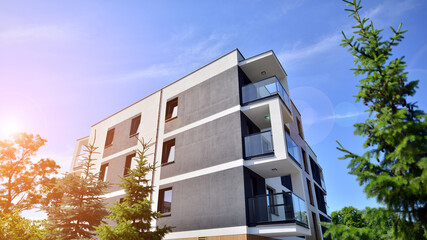 Modern luxury residential flat. Modern apartment building on a sunny day. Apartment building with a blue sky. Facade of a modern apartment building.