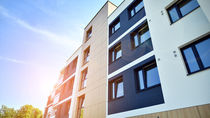 Modern luxury residential flat. Modern apartment building on a sunny day. Apartment building with a blue sky. Facade of a modern apartment building.