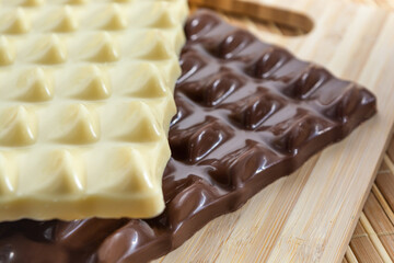 white chocolate and milk chocolate or dark chocolate concept background with delicious and creamy quality with text area