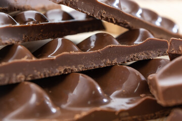 close-up macro detailed shot of milk chocolate pieces background