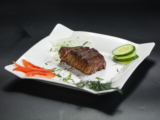 Grilled beef steak served onion
