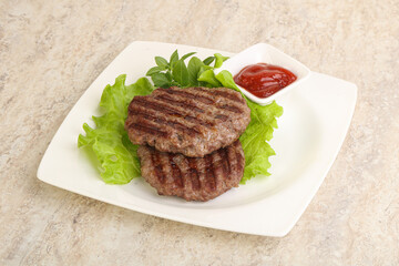 Grilled beef burger cutlet with sauce