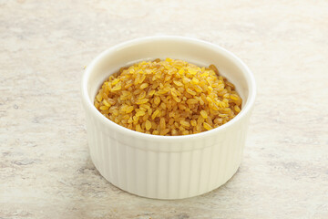 Raw bulgur in the bowl
