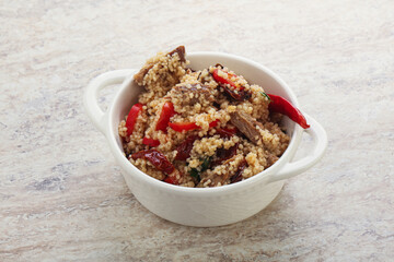 Arabic cous cous with meat and tomato