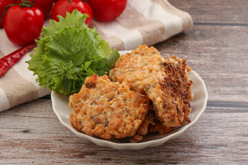 Fried salmonn cutlet in the bowl