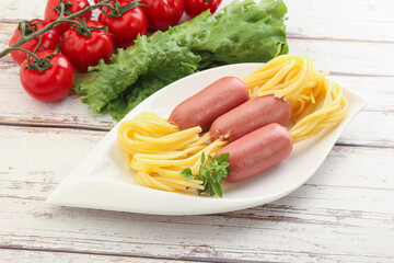 Mini sausages with pasta spaghetti