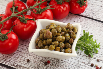 Marinated green capers in the bowl