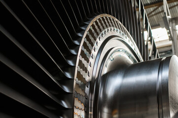 Shiny rotor of powerful steam turbine in light workshop © nordroden