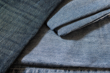 Denim fabric, top view, close-up. Abstract jeans background