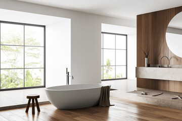 Fototapeta na wymiar Light bathroom interior with washbasin and tub, panoramic window