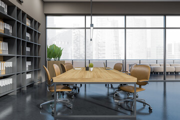 Grey office room interior with chairs, table with laptop and panoramic window