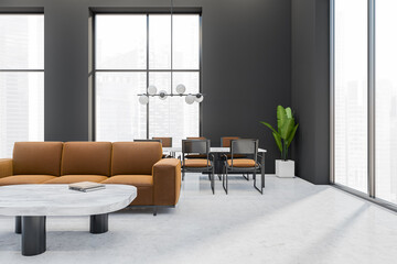 Modern meeting room interior with couch, table and seats, panoramic window