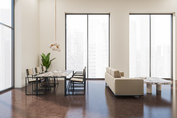 Light guest space interior with couch, table and chairs, panoramic window