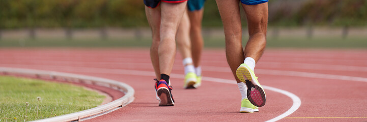 Athletes on track in race walk competition, race walking on athletic track