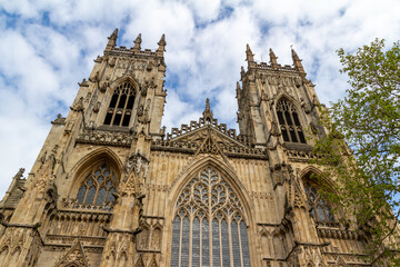 Fototapeta na wymiar Close up exterior front view of The Cathedral and Metropolitical Church of Saint Peter, more commonly known as York Minster, in the city of York, England