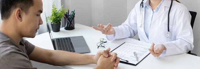 Specialist doctors advise and examine the history of patients in a direct health room at a modern...