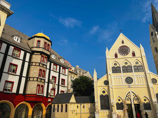 a church and houses in historic european style at sunset moment in nanshan district, shenzhen, china