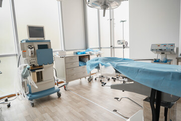 Interior of operation room with different medical equipment ready for surgery
