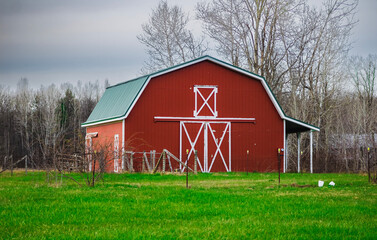 A red barn in a field in Orwell, Ohio
