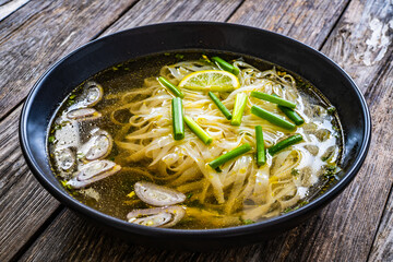 Pho soup - Vietnamese soup on wooden table