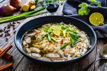 Pho soup - Vietnamese soup on wooden table