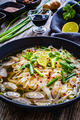 Pho soup - Vietnamese soup on wooden table