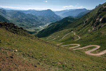 Pass and road below in summer in Kyrgyzstan