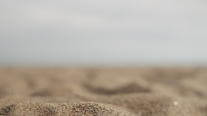 Fototapeta na wymiar closeup focus pull on sandy beach