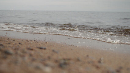 closeup shot of waves rolling on a beach on Baltic Sea