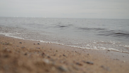 closeup shot of waves rolling on a beach on Baltic Sea