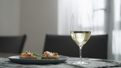 white wine in glass on dinning table with copy space