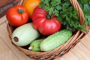 Basket with vegetables. Tomato, eggplant, cucumber, zucchini. Organic food.