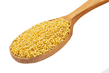 Dry millet groats in a wooden spoonl, isolated on white background. Full depth of field.