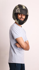Indian collage boy wears black helmet or head protection gear for safety on white background with different expressions also person pointing by hand to helmet copy space proud and confident