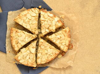 Almond cake with prunes. Bakewell tart, top view, copy space