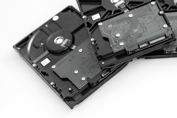 several hard drives for computer systems are located on a light background, toned image