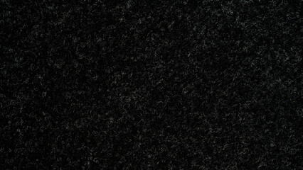 Closeup of seamlessly black and grey carpeting for background and design.