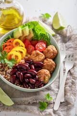 Wholesome Mexican salad with meatballs, beans, pepper and groats.