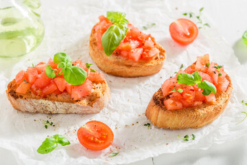 Crisp and healthy bruschetta with basil and tomatoes for breakfast.
