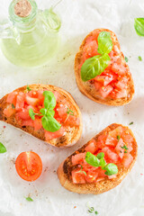 Tasty and fresh bruschetta with tomato and herbs for breakfast.