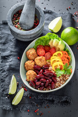 Healthy Mexican salad as meal with meat and groats.
