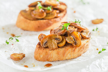 Crisp and hot bruschetta with mushrooms for breakfast.