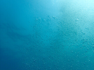 Soft focus on the air bubble in the blue ocean