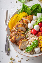 Fit Caesar salad with cheese, chicken and groats.