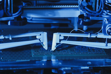 Needle automatic equipment diagnose and test chips and processors. Automated Robotic Industrial Equipment is Testing Electronic Printed Circuit Board. Manufacture of electronic chips. High-tech, close