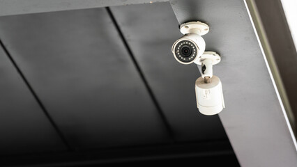 A security wireless camera which is installed at ceiling, using to monitor around the area. Technology and object photo.